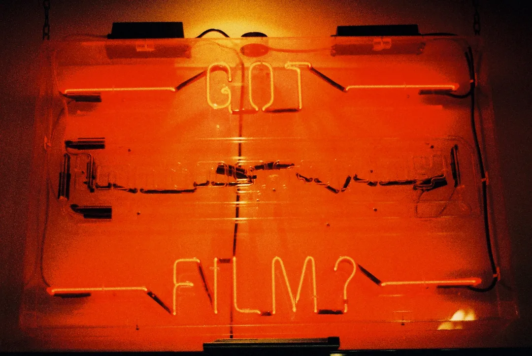 A neon sign asking: got film?